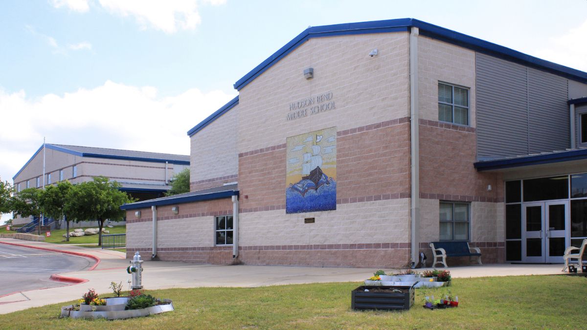 Hudson Bend Middle School building with a mural and landscaped front yard